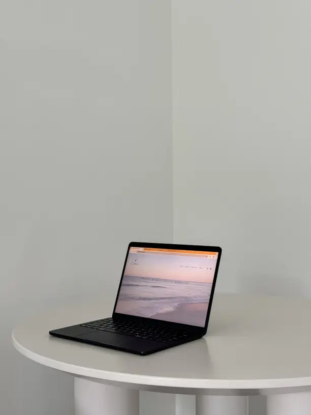 A creator working at a desk surrounded by screens showing analytics and content