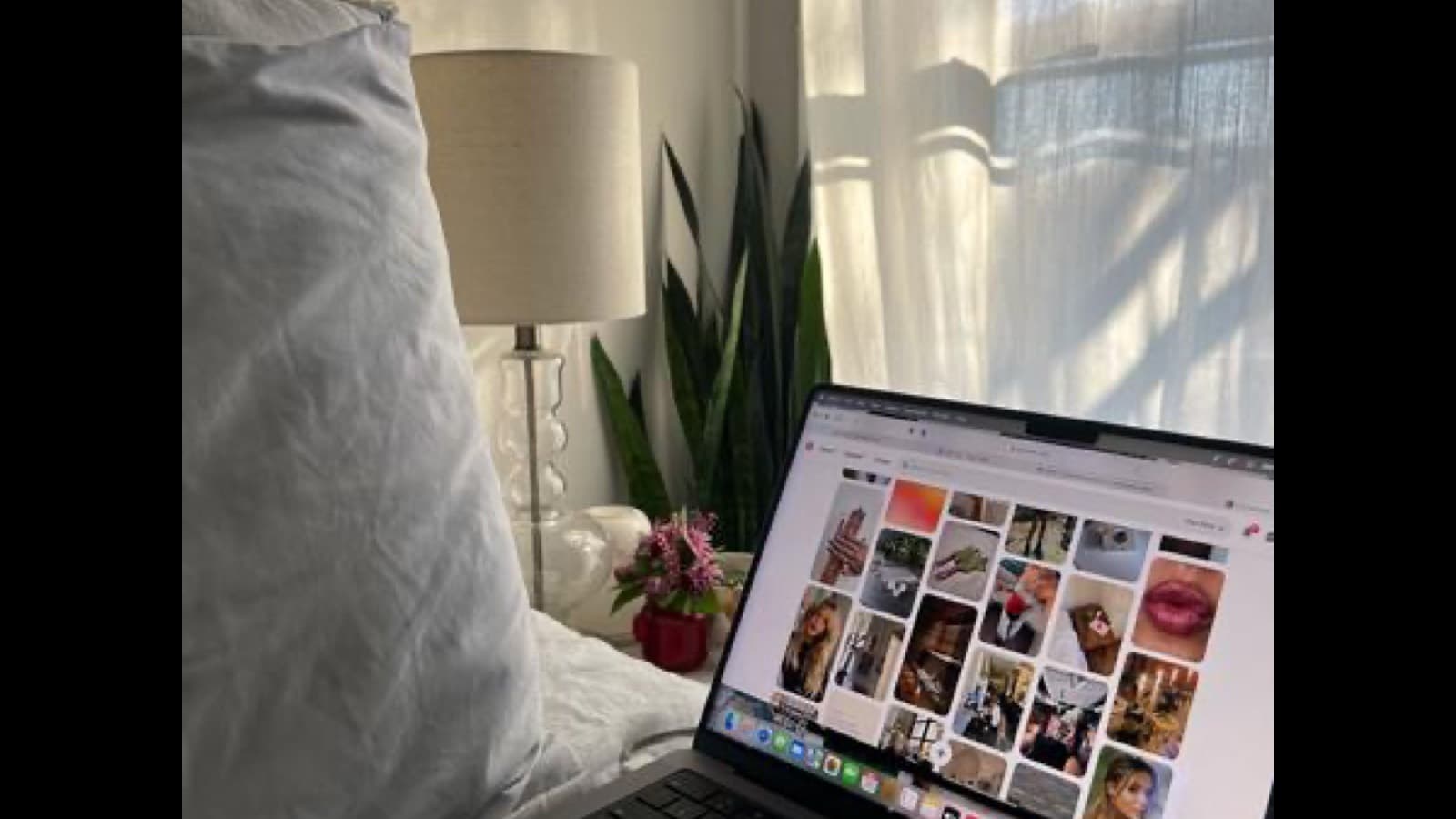 Laptop on a desk displaying a portfolio website design