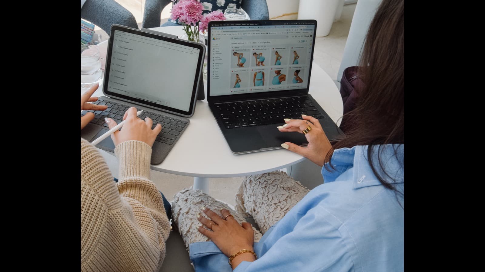 Group of creative professionals collaborating around a table with laptops
