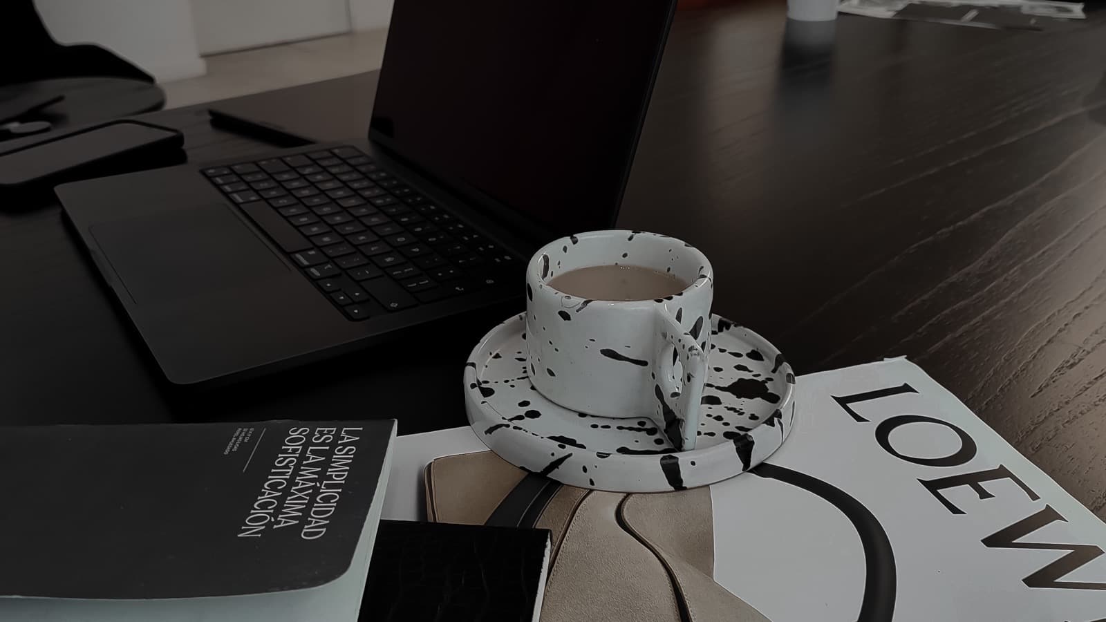 Clean creator workspace with a laptop and monitor ready for a virtual assistant