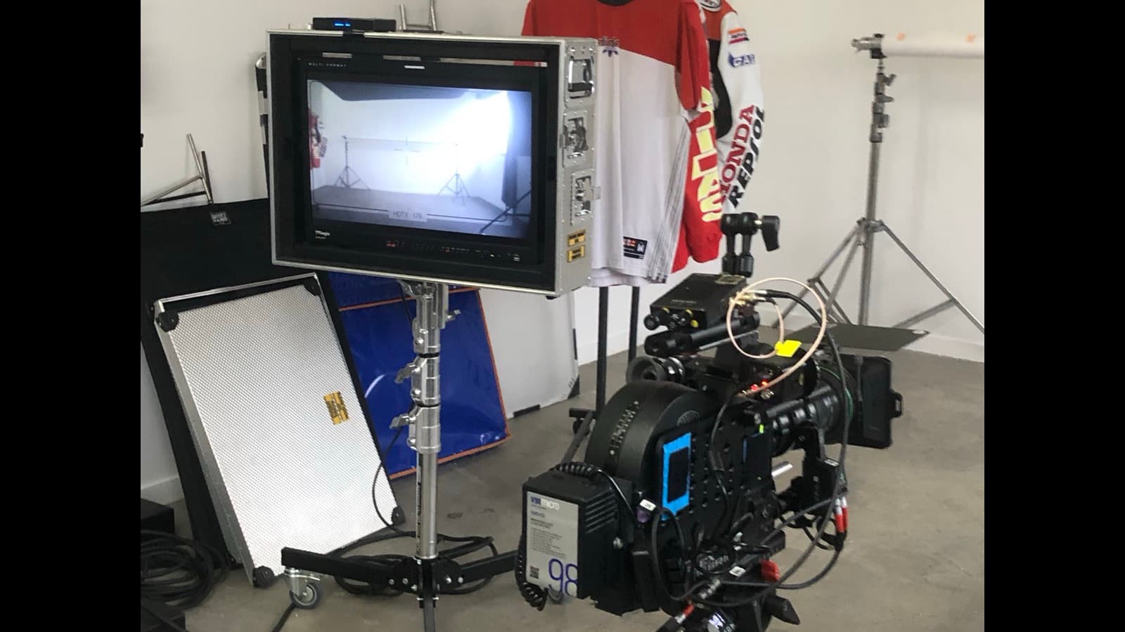 Content creator recording video in front of a bright studio light setup