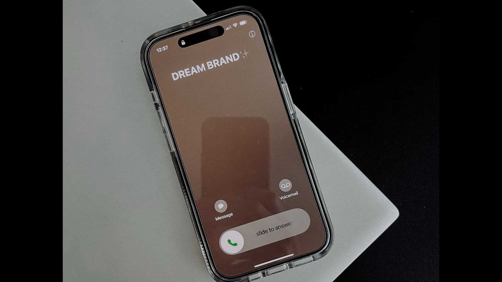 Hand holding a smartphone showing a bright screen with social media content