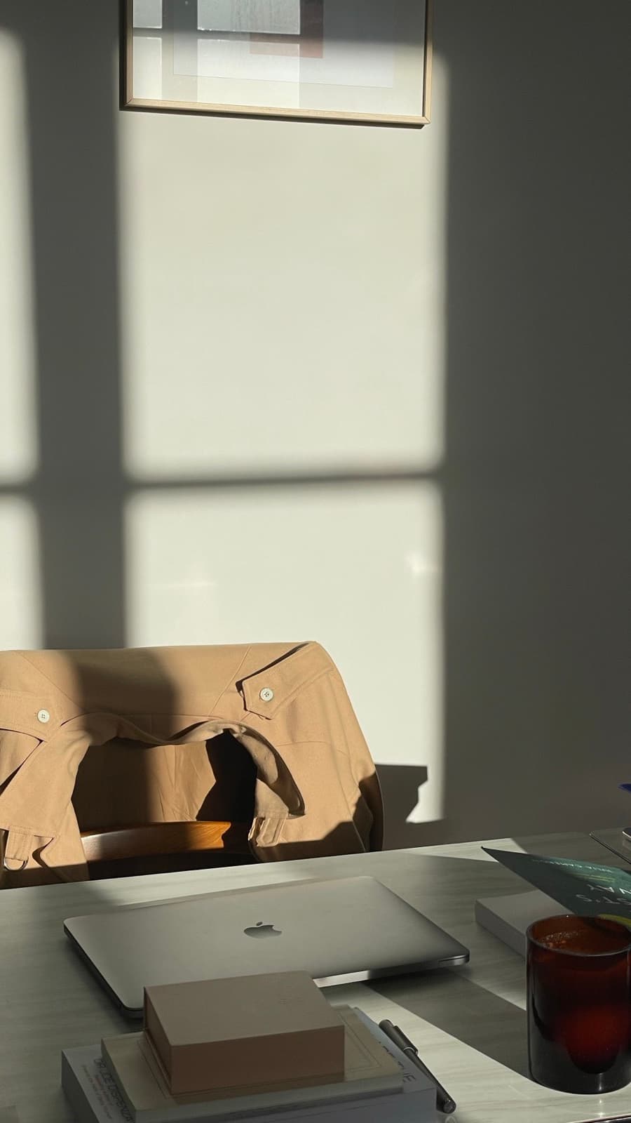 Desk with paperwork, a laptop, and a notebook during a small business setup session