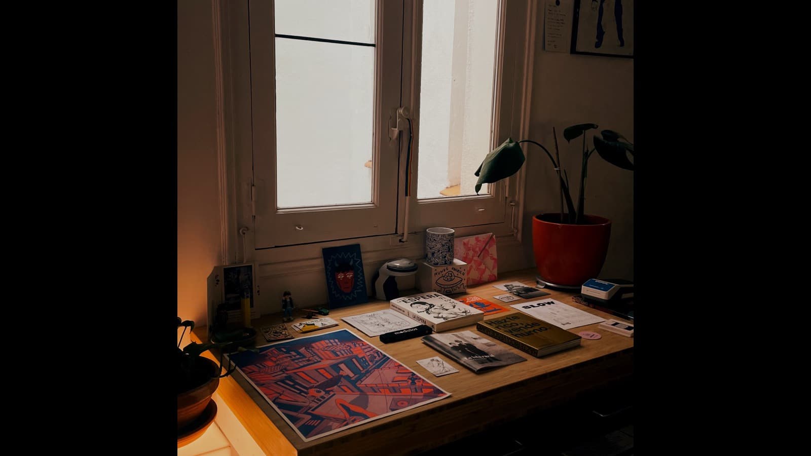 A tidy creative workspace with a notebook, planning pins and content ideas