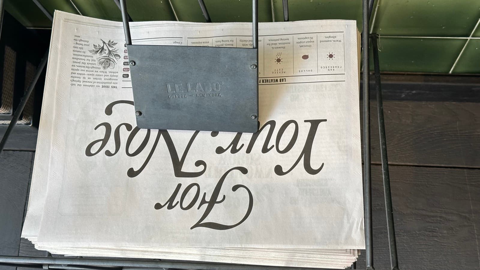 Person reading a newspaper, representing newsletters and long-form reading