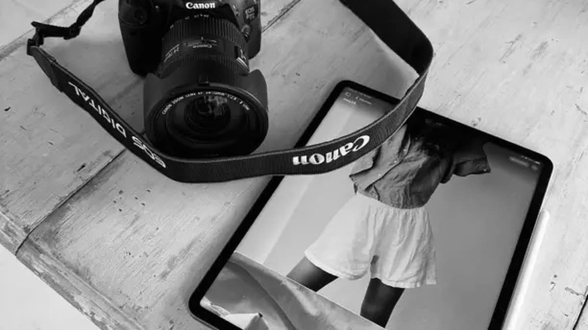 Camera and tablet arranged on a creative worktable