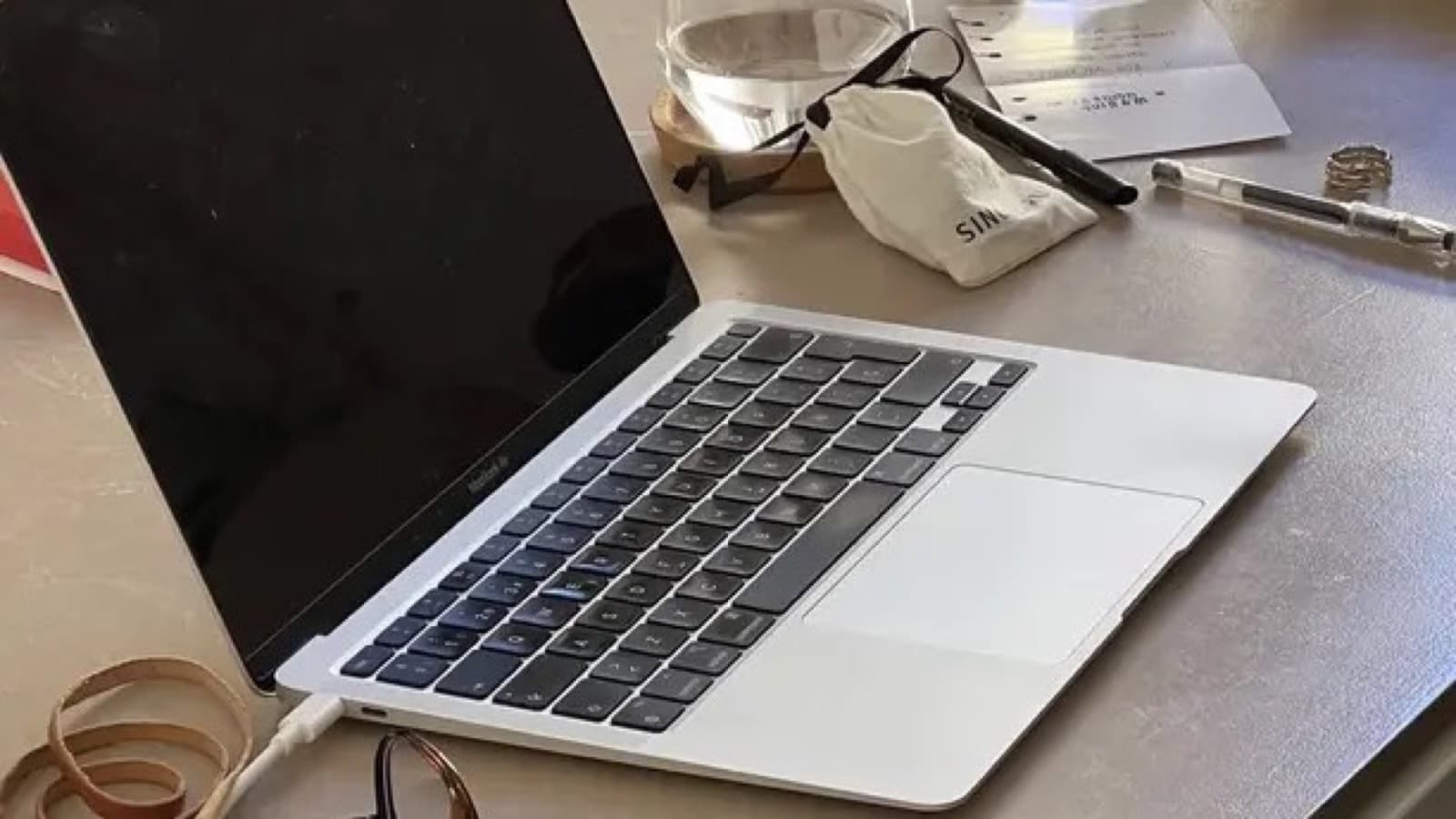 Neat desk setup with laptop, notebook, and coffee ready for a focused work session