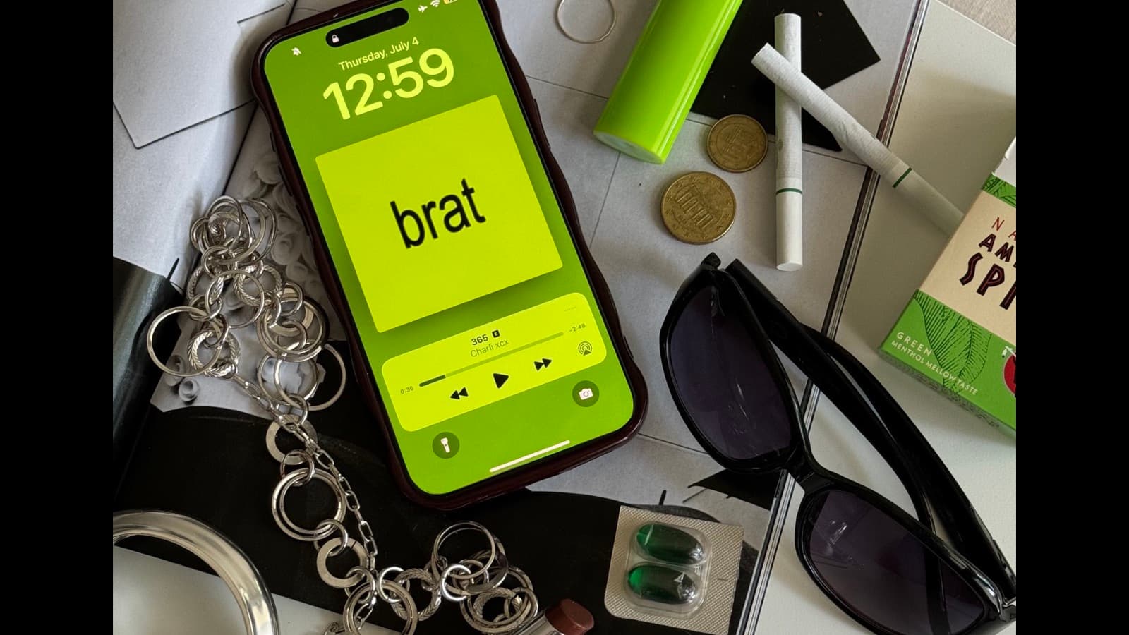 Hand holding a smartphone with messaging app open