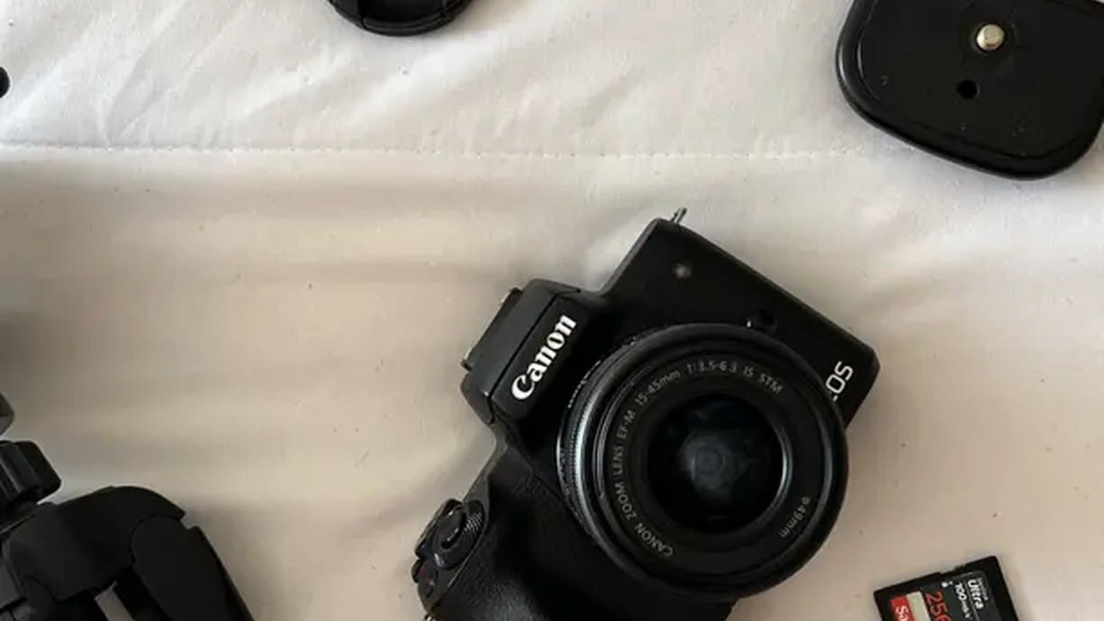 A Canon camera used for filming YouTube videos on a bright studio setup