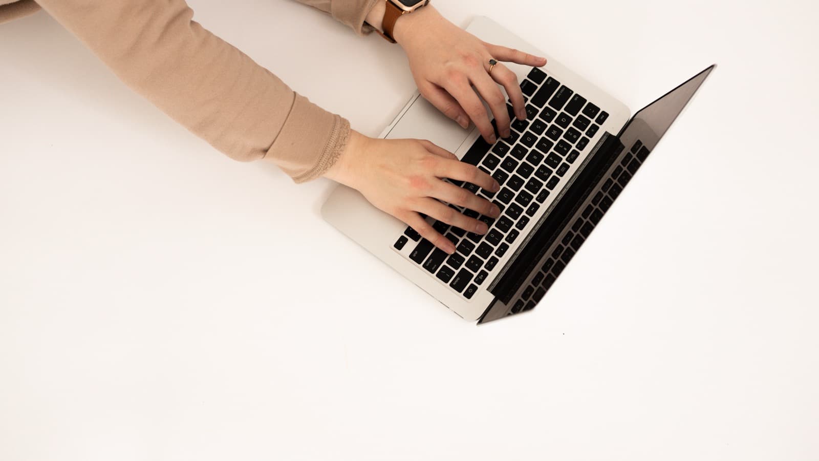 Open laptop on a desk showing analytics charts and graphs