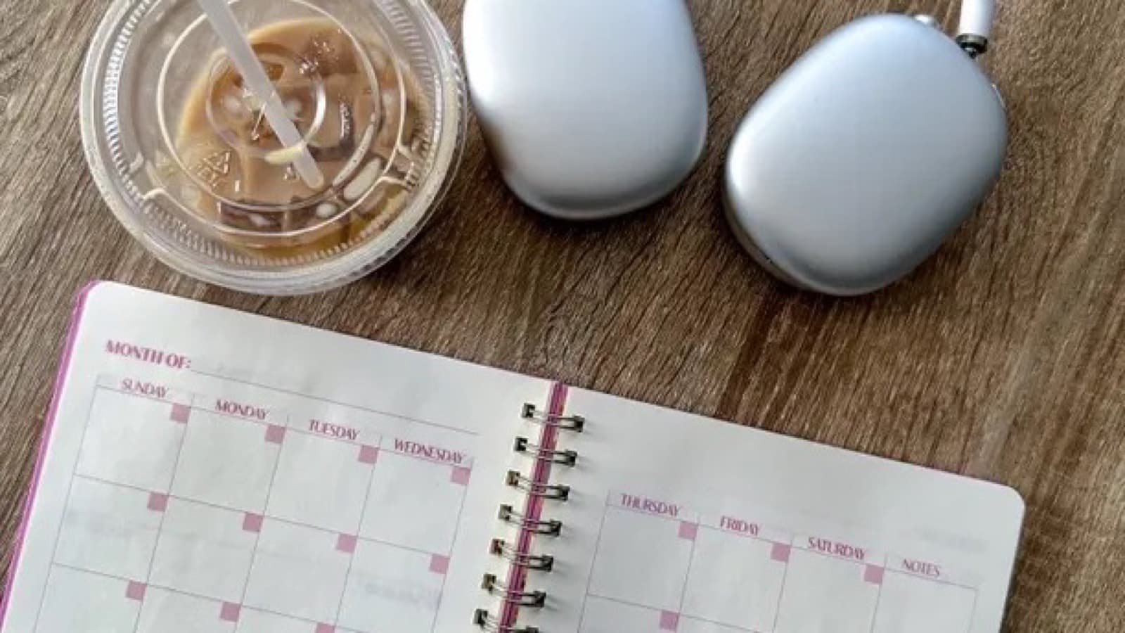 Open planner with a monthly content calendar and colorful sticky notes