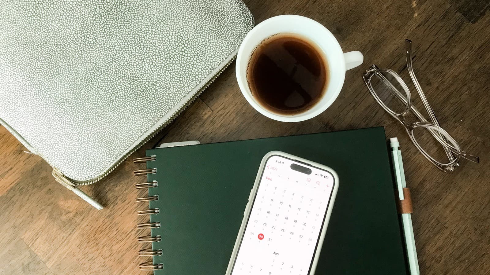 Person reviewing charts and notes on a laptop while planning their finances