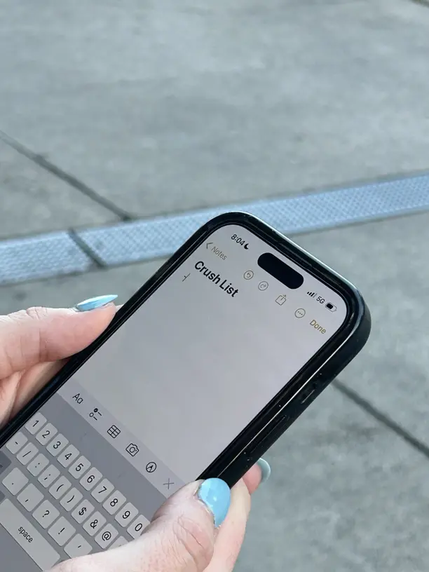 A smartphone displaying creative Instagram Story designs with interactive stickers